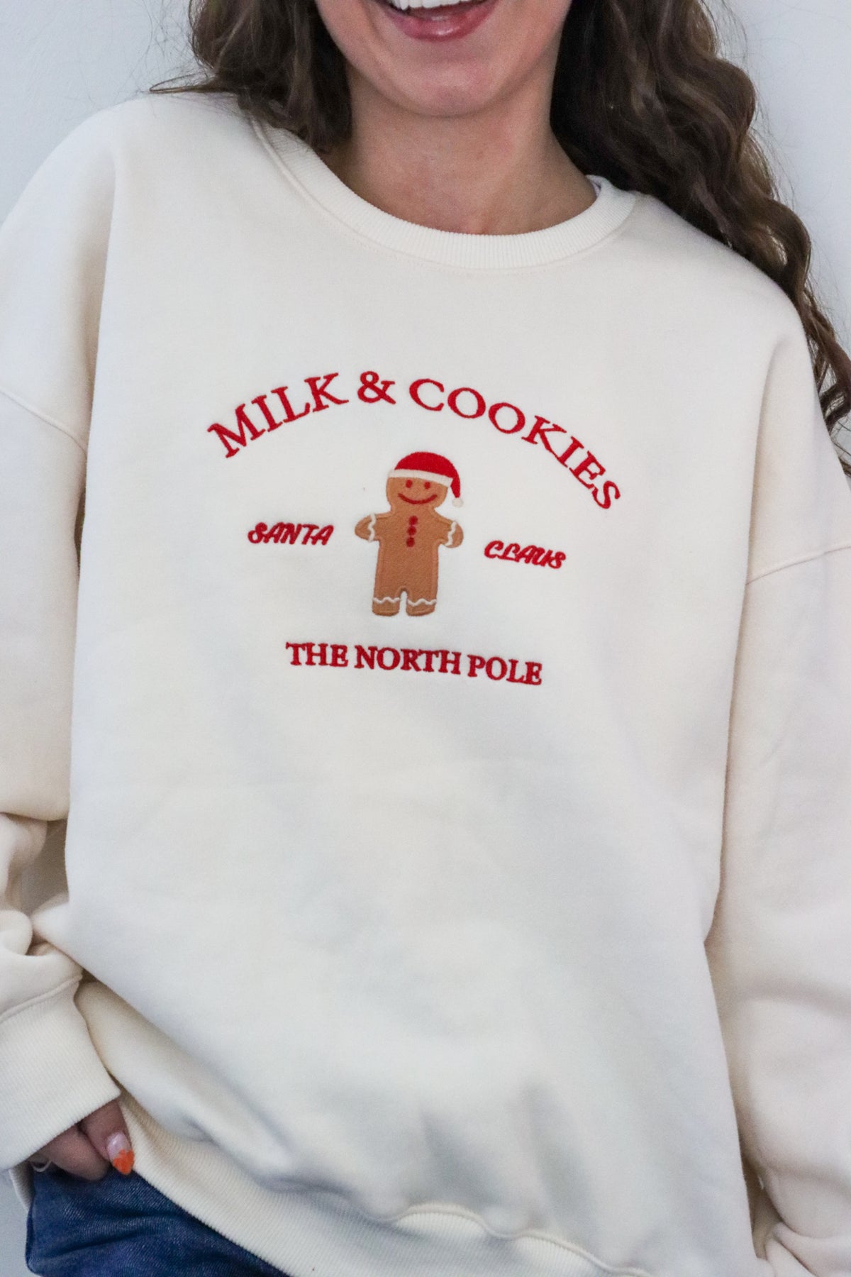 girl wearing cream milk & cookies crewneck