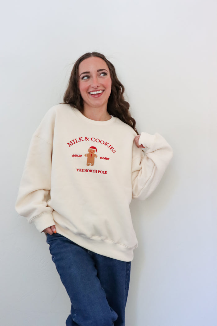 girl wearing cream milk & cookies crewneck