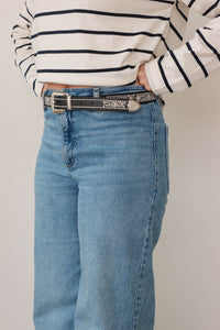 girl wearing black western style belt