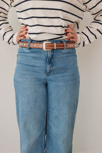 girl wearing brown western style belt