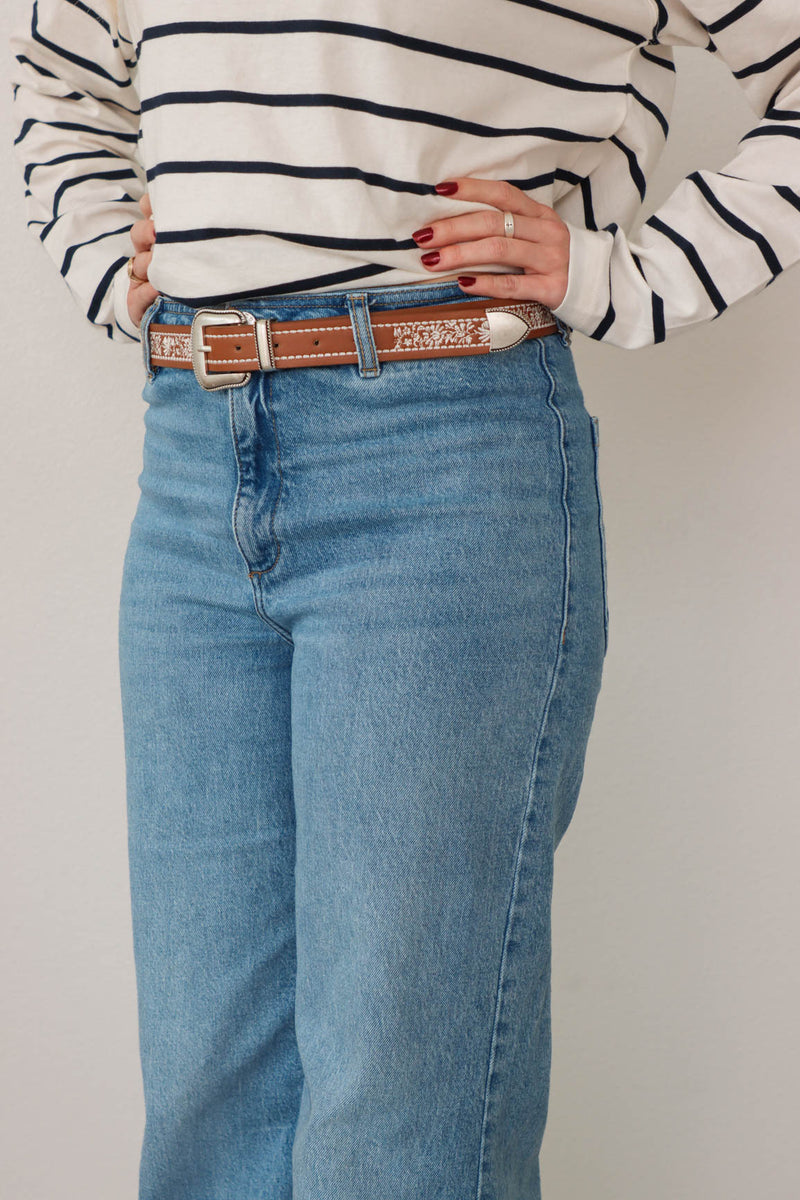 girl wearing brown western style belt