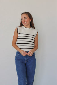 girl wearing white & black knit tank top