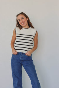 girl wearing white & black knit tank top