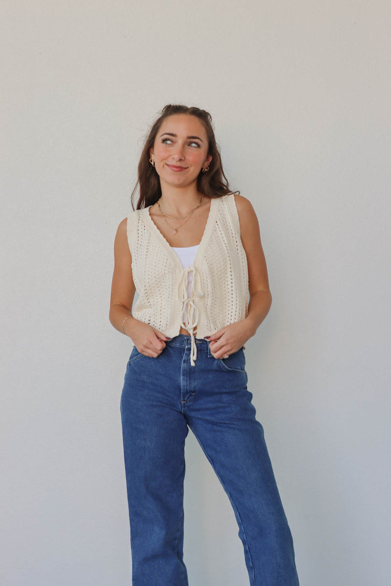 girl wearing cream crochet tank top