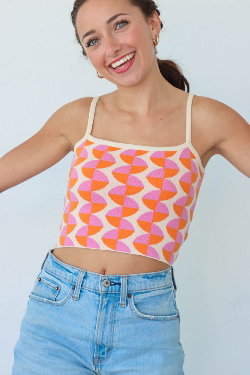 girl wearing pink and orange retro patterned knit tank top