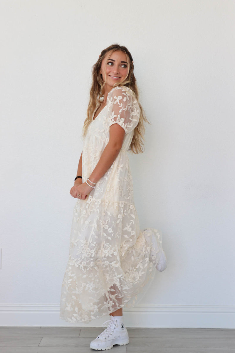 girl wearing cream/white long lace dress