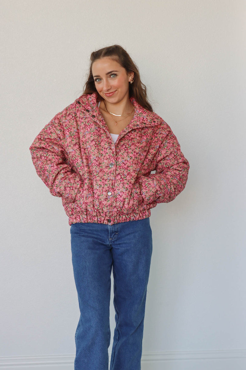 girl wearing pink floral coat