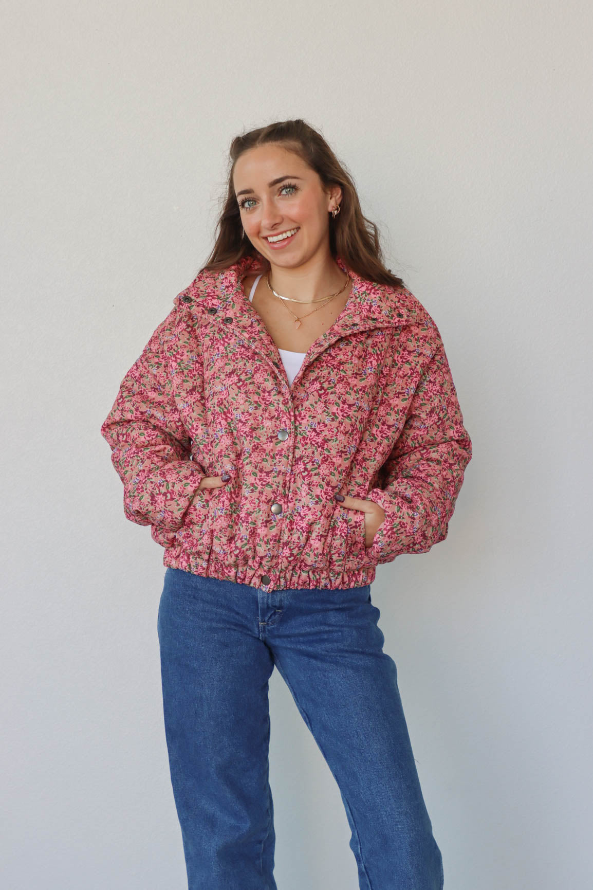 girl wearing pink floral coat