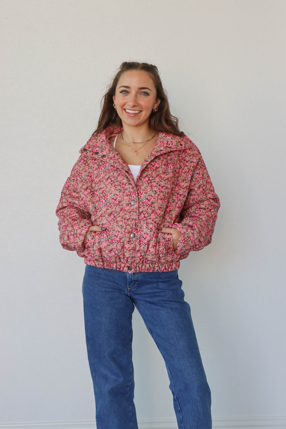 girl wearing pink floral coat