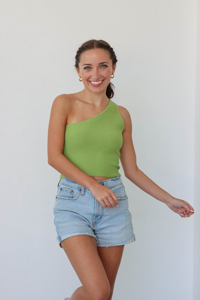 girl wearing one shoulder lime green tank top