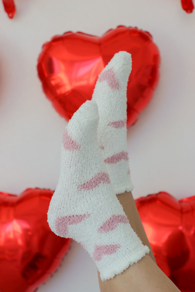 white fuzzy crew socks with light pink heart pattern