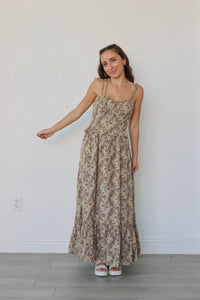 girl wearing tan & brown floral maxi dress