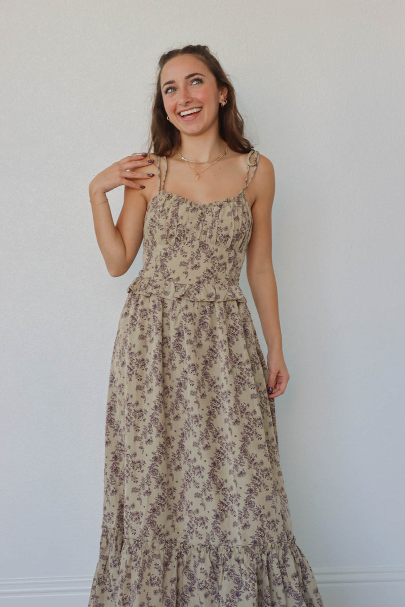 girl wearing tan & brown floral maxi dress