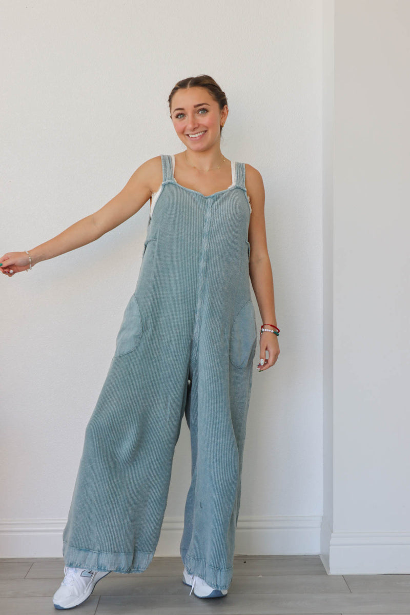 girl wearing blue waffle knit jumpsuit