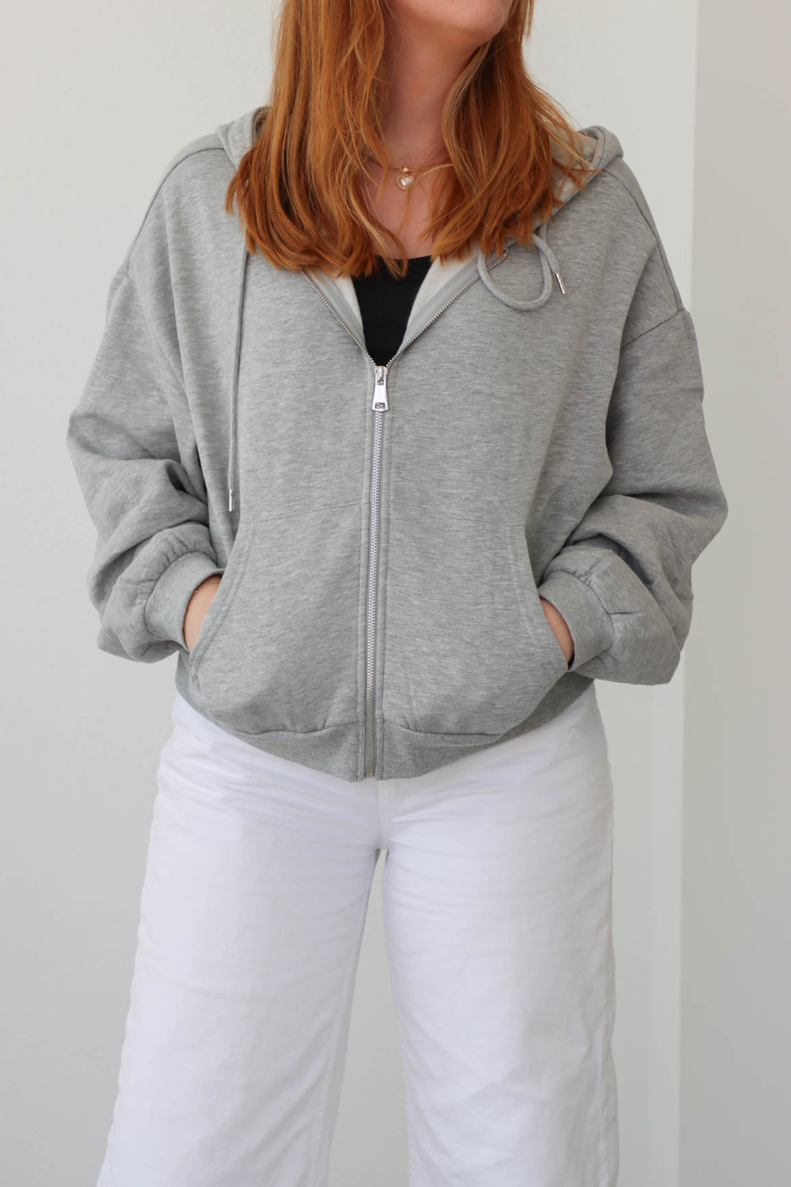 girl wearing light gray hoodie