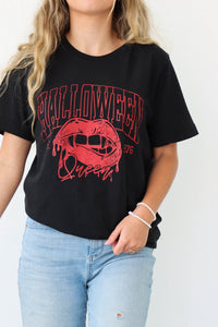 girl wearing black "Halloween Queen" graphic t-shirt