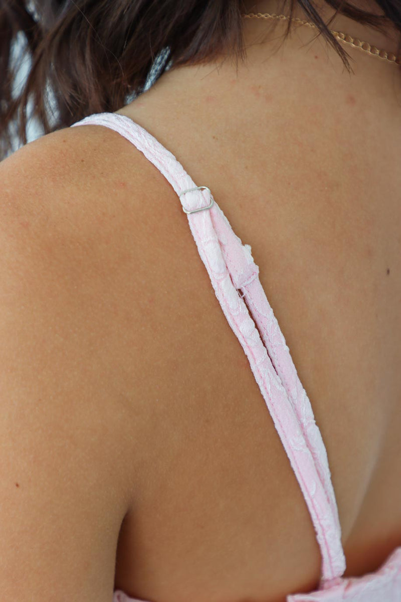adjustable straps on light pink dress