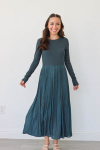 girl wearing teal long dress