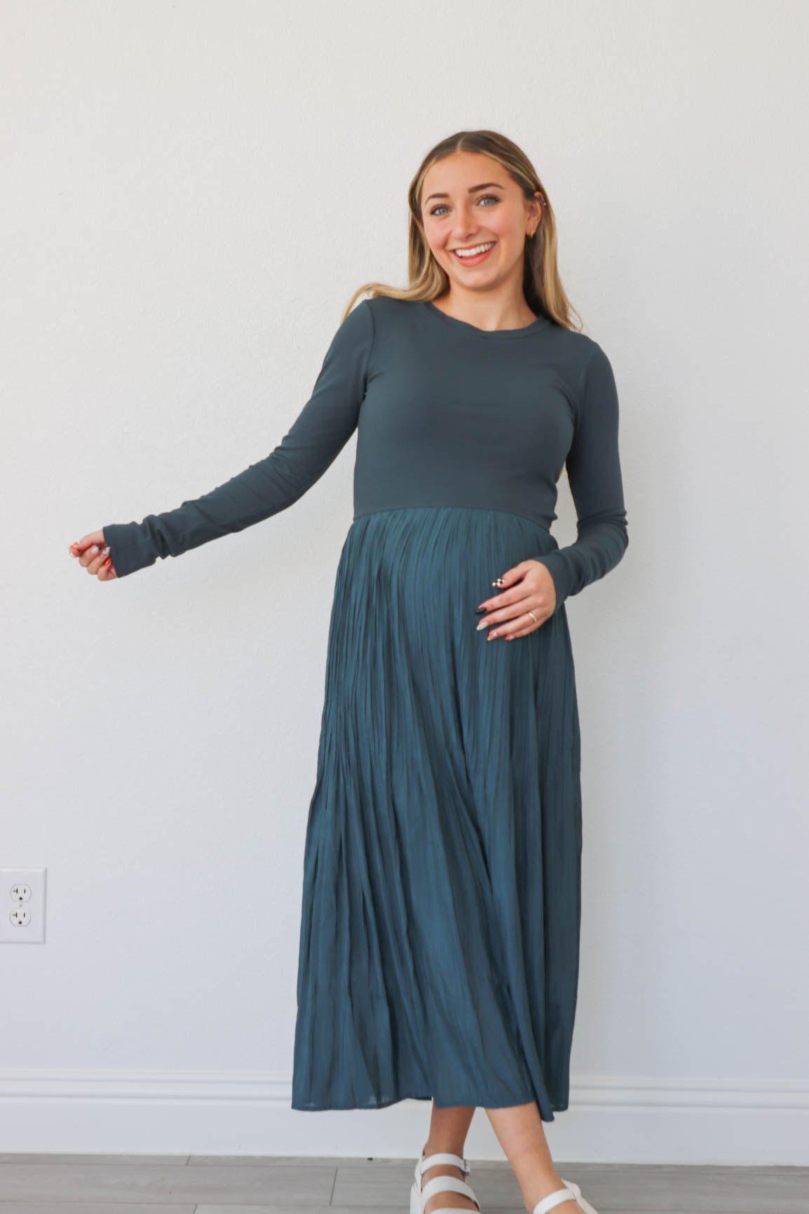 girl wearing teal long dress