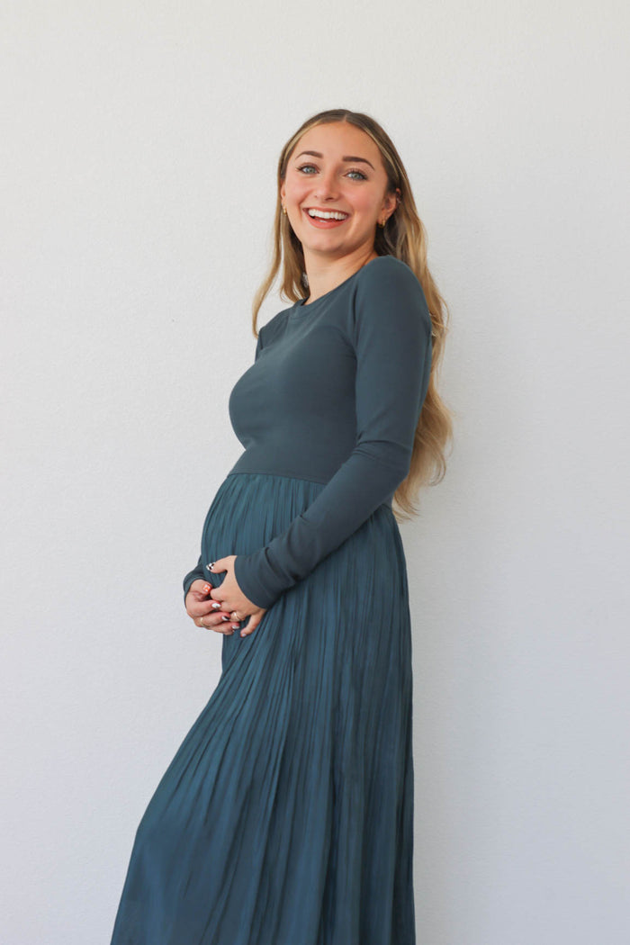 girl wearing teal long dress