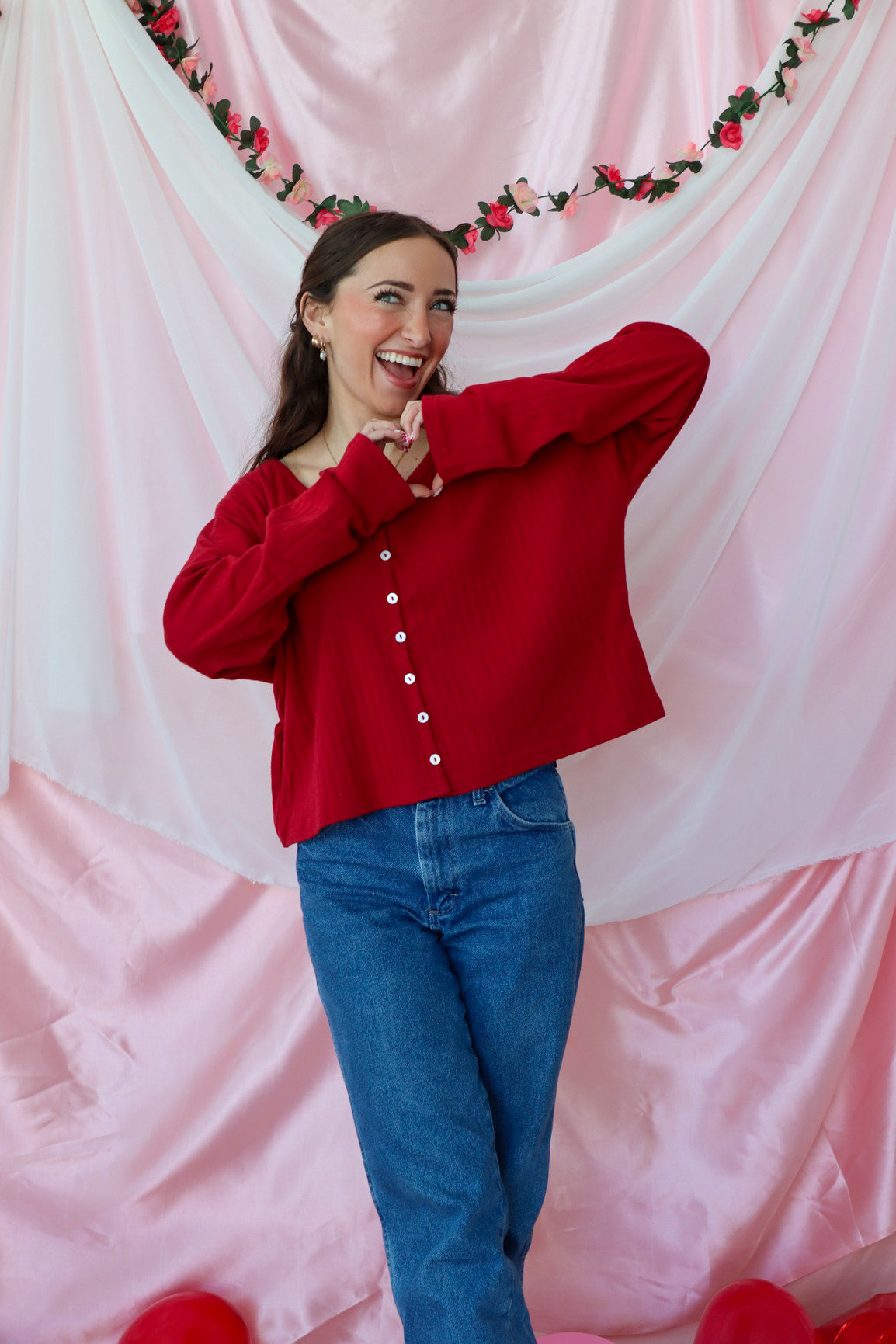 girl wearing red button down top