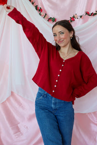 girl wearing red button down top