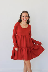 girl wearing red short dress with long sleeves