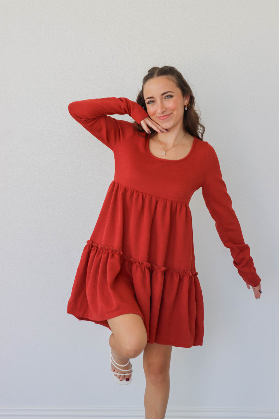 girl wearing red short dress with long sleeves