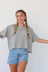girl wearing gray waffle knit t-shirt