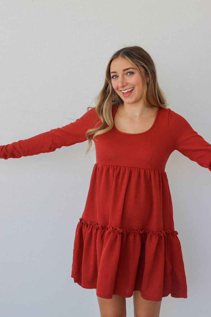 girl wearing red short dress with long sleeves