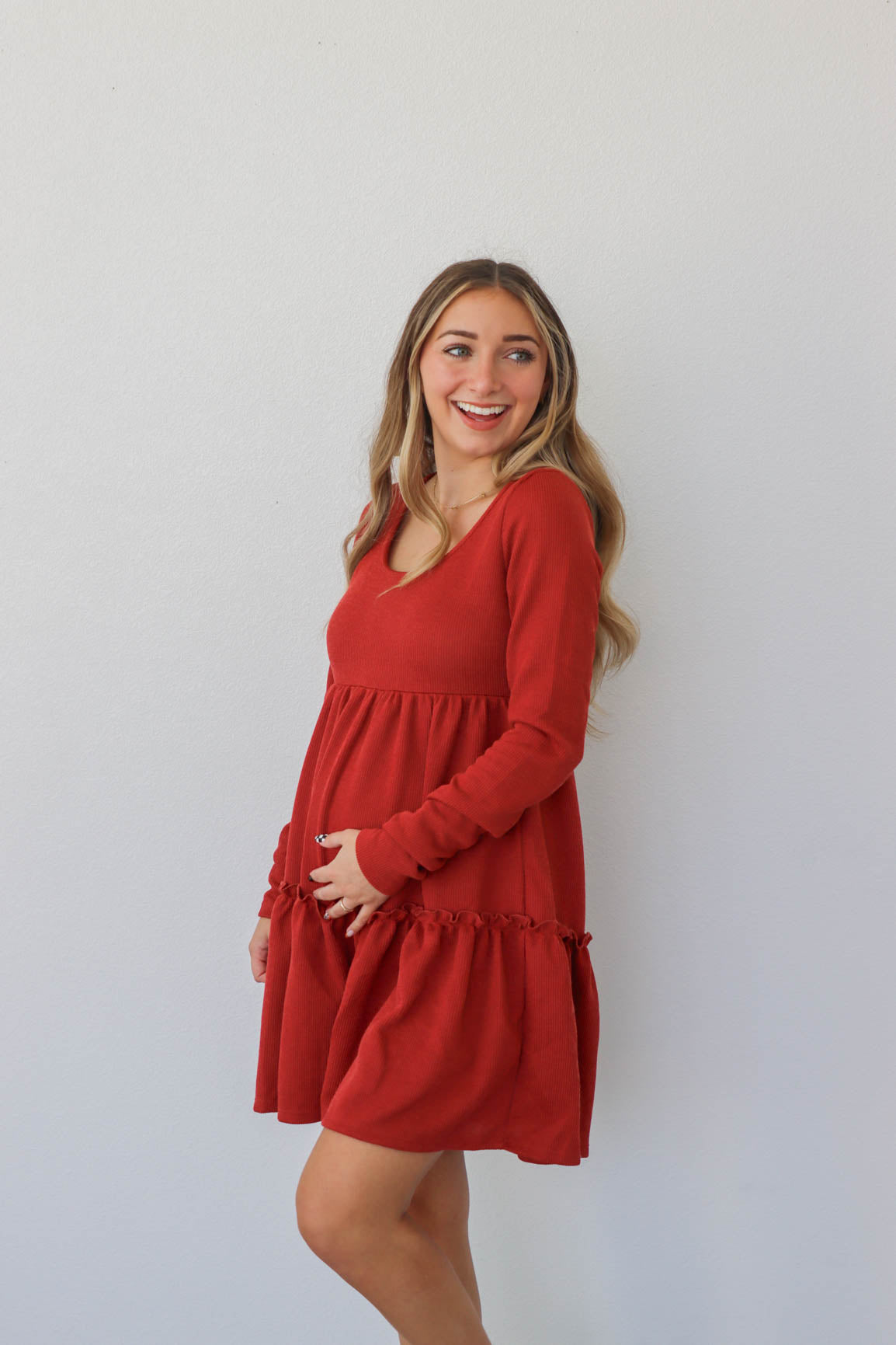 girl wearing red short dress with long sleeves