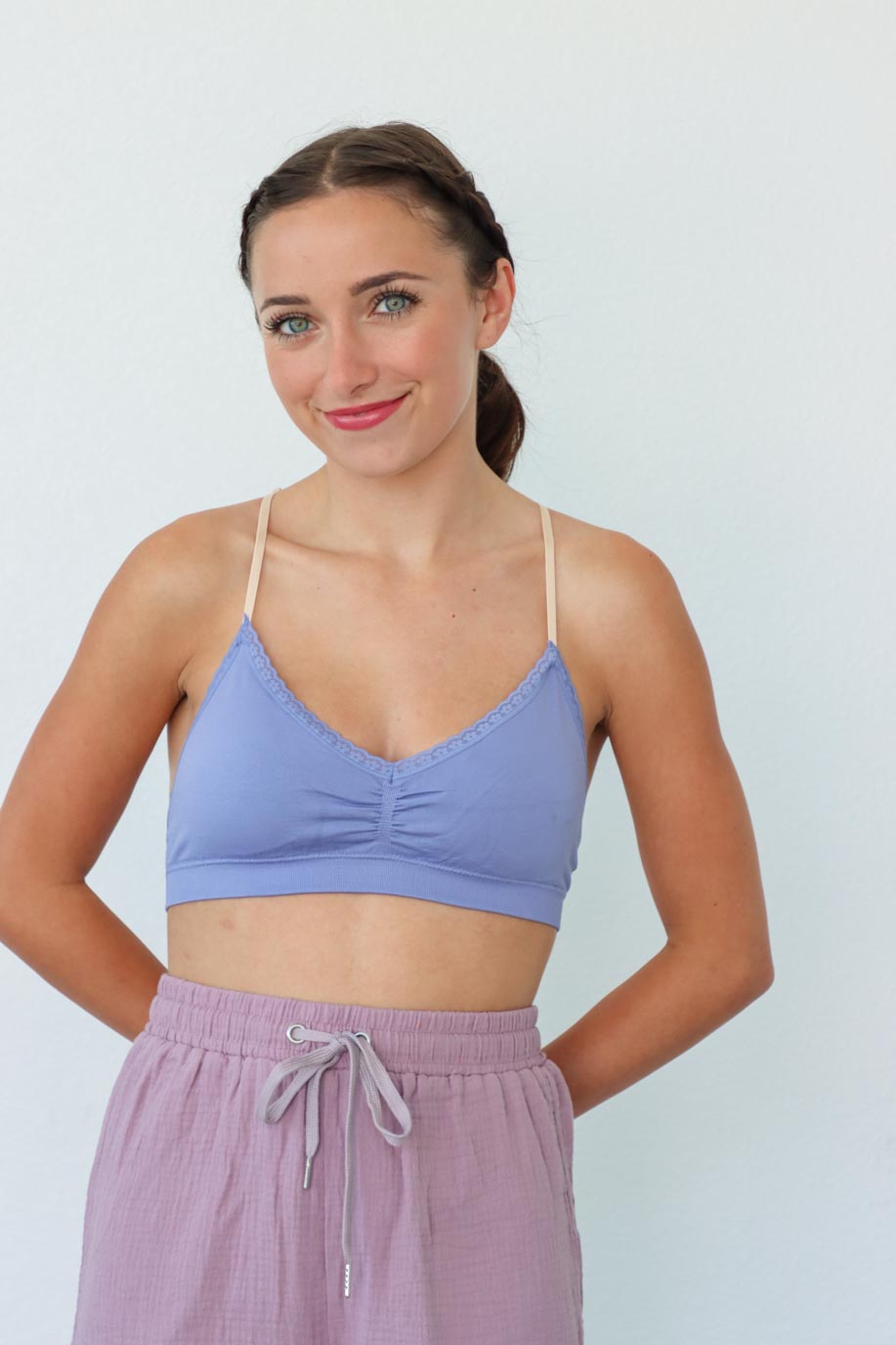 girl wearing lavender bralette top with floral lace back detailing