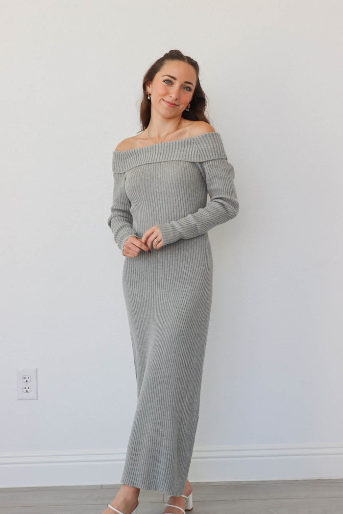 girl wearing long gray knit off the shoulder dress