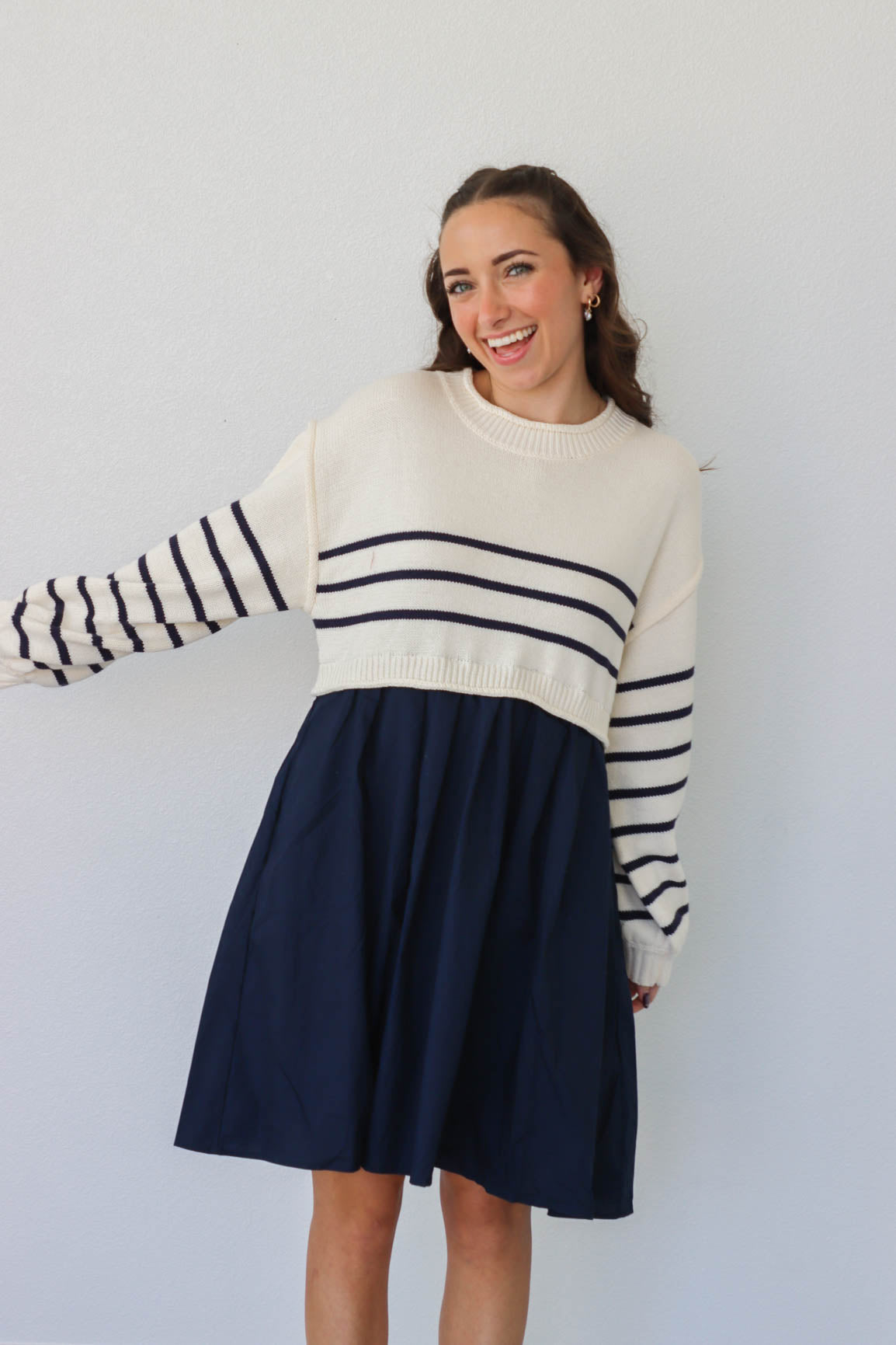 girl wearing cream and navy dress