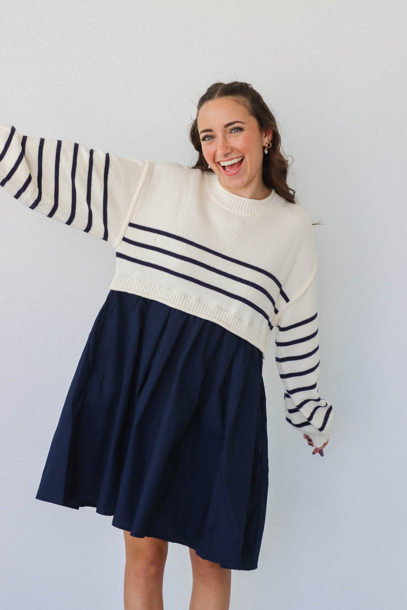 girl wearing cream and navy dress