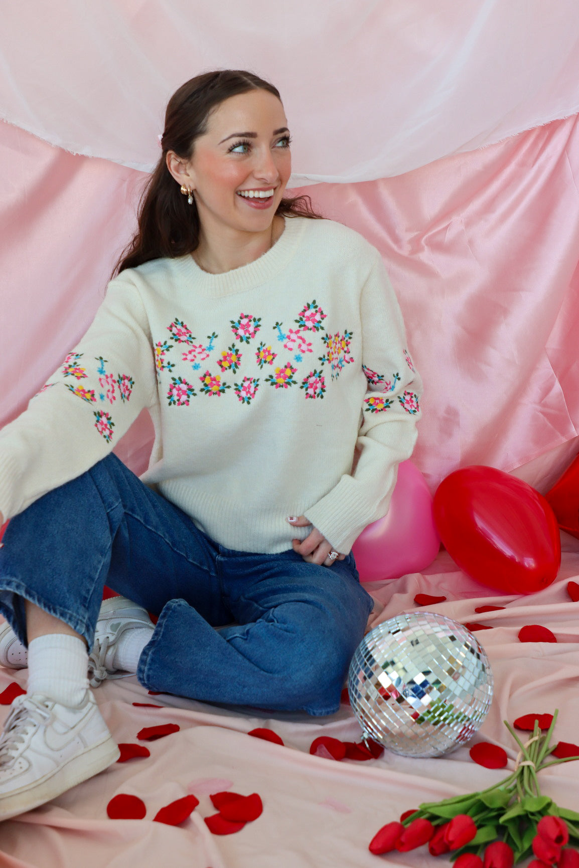 girl wearing cream floral sweater