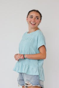 girl wearing blue loose top