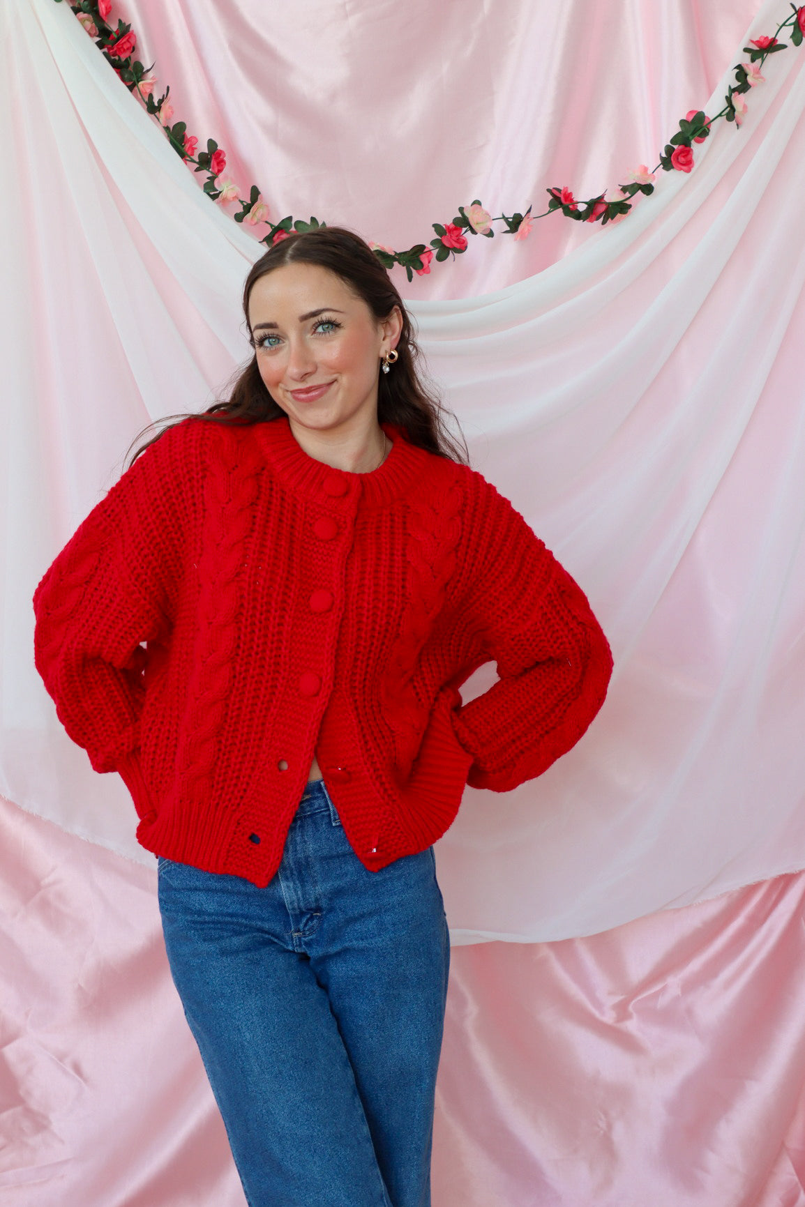 girl wearing red knit cardigan