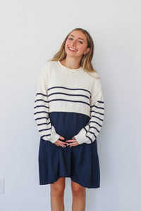 girl wearing cream and navy dress