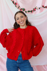 girl wearing red knit cardigan