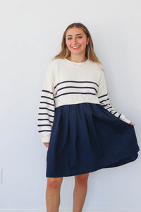 girl wearing cream and navy dress