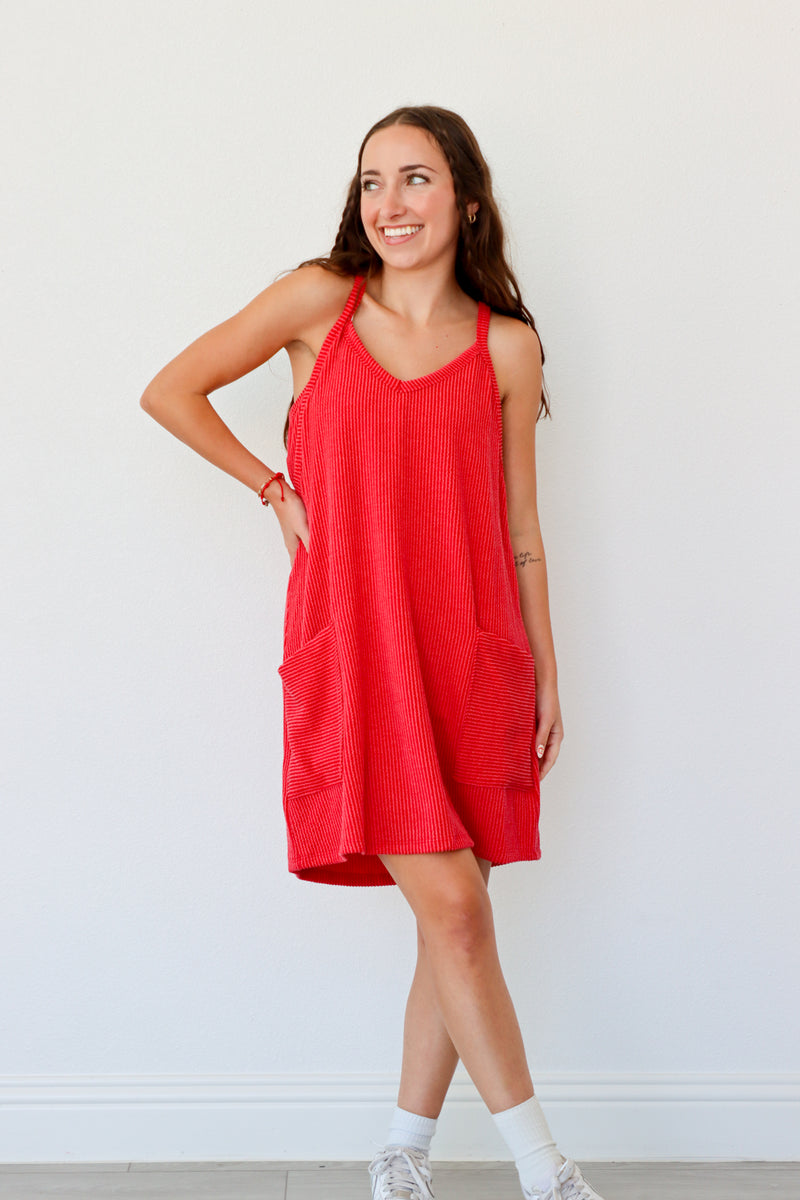 Woman wearing a red dress against a white background