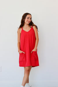 Woman wearing a red dress against a white background