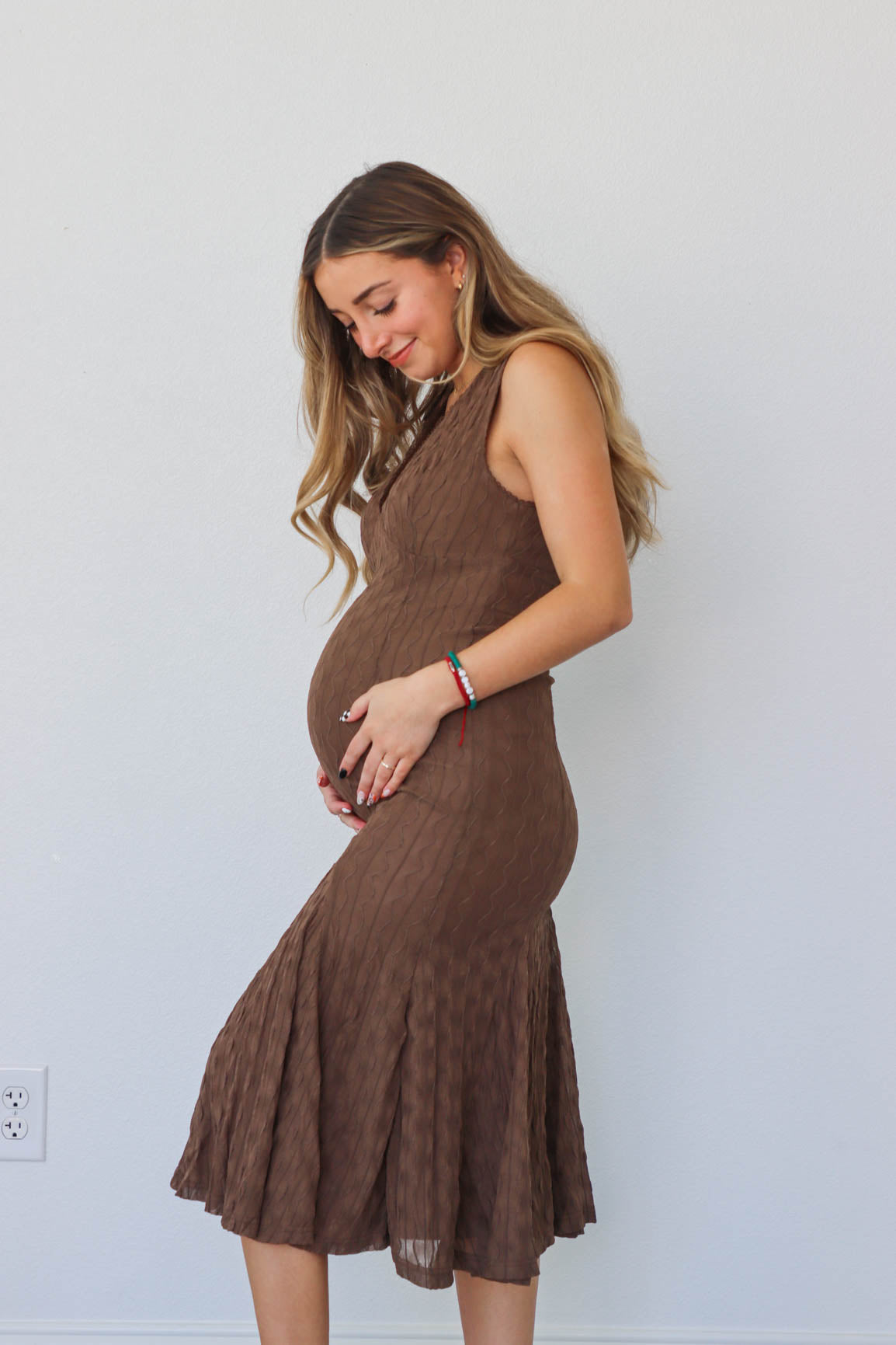 girl wearing brown midi dress