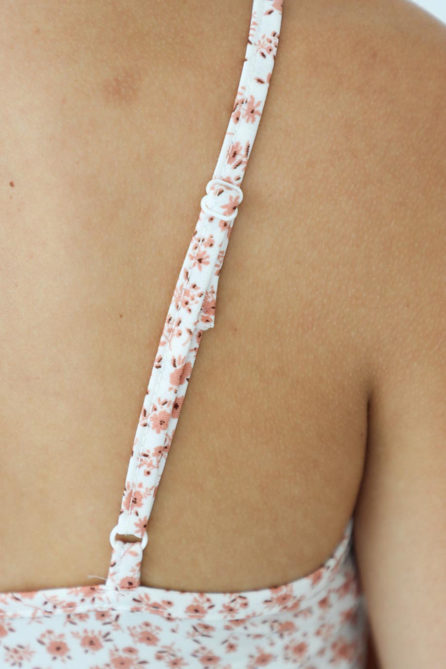 adjustable straps on pink floral tank top