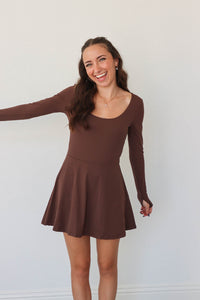 girl wearing brown athletic dress