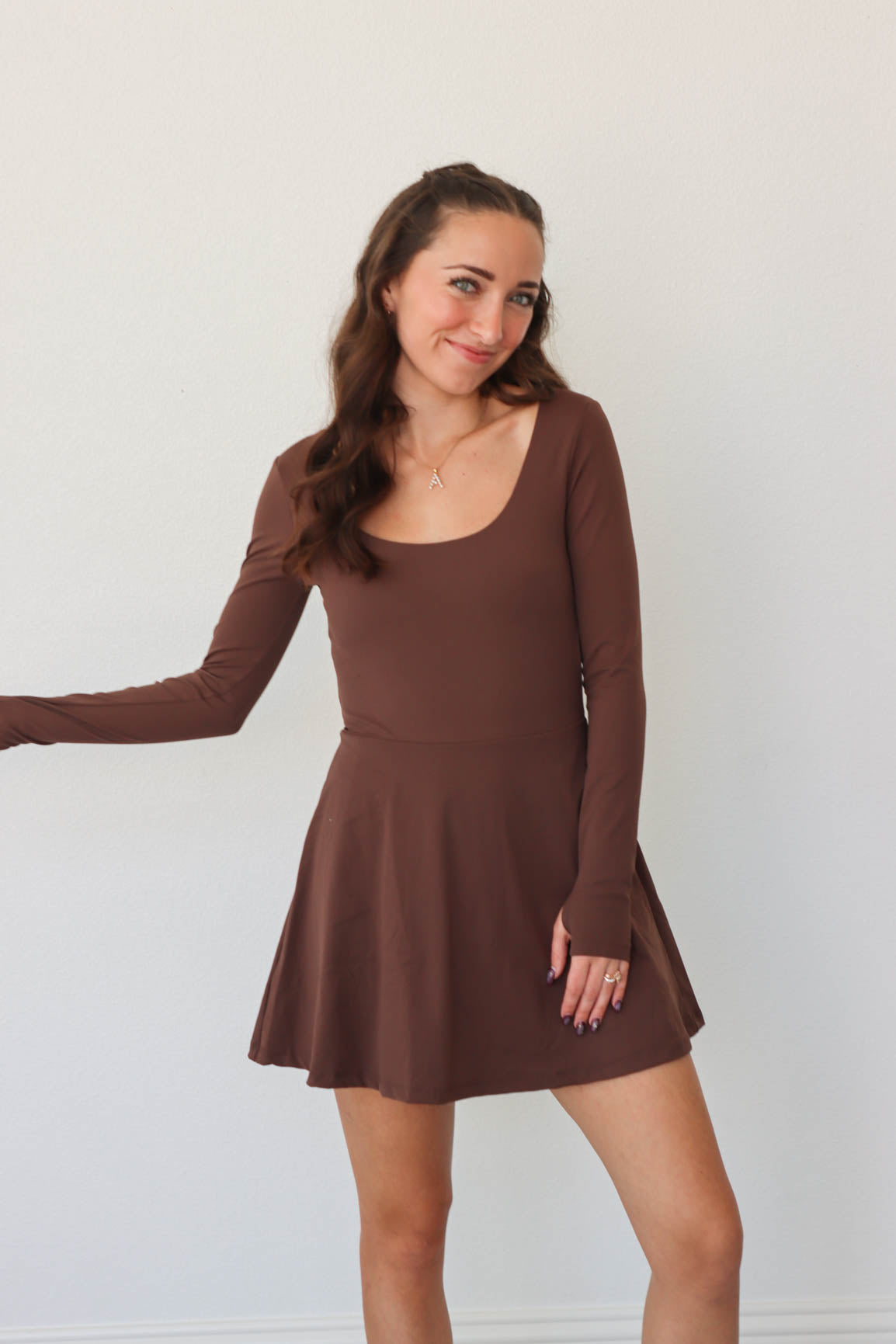 girl wearing brown athletic dress