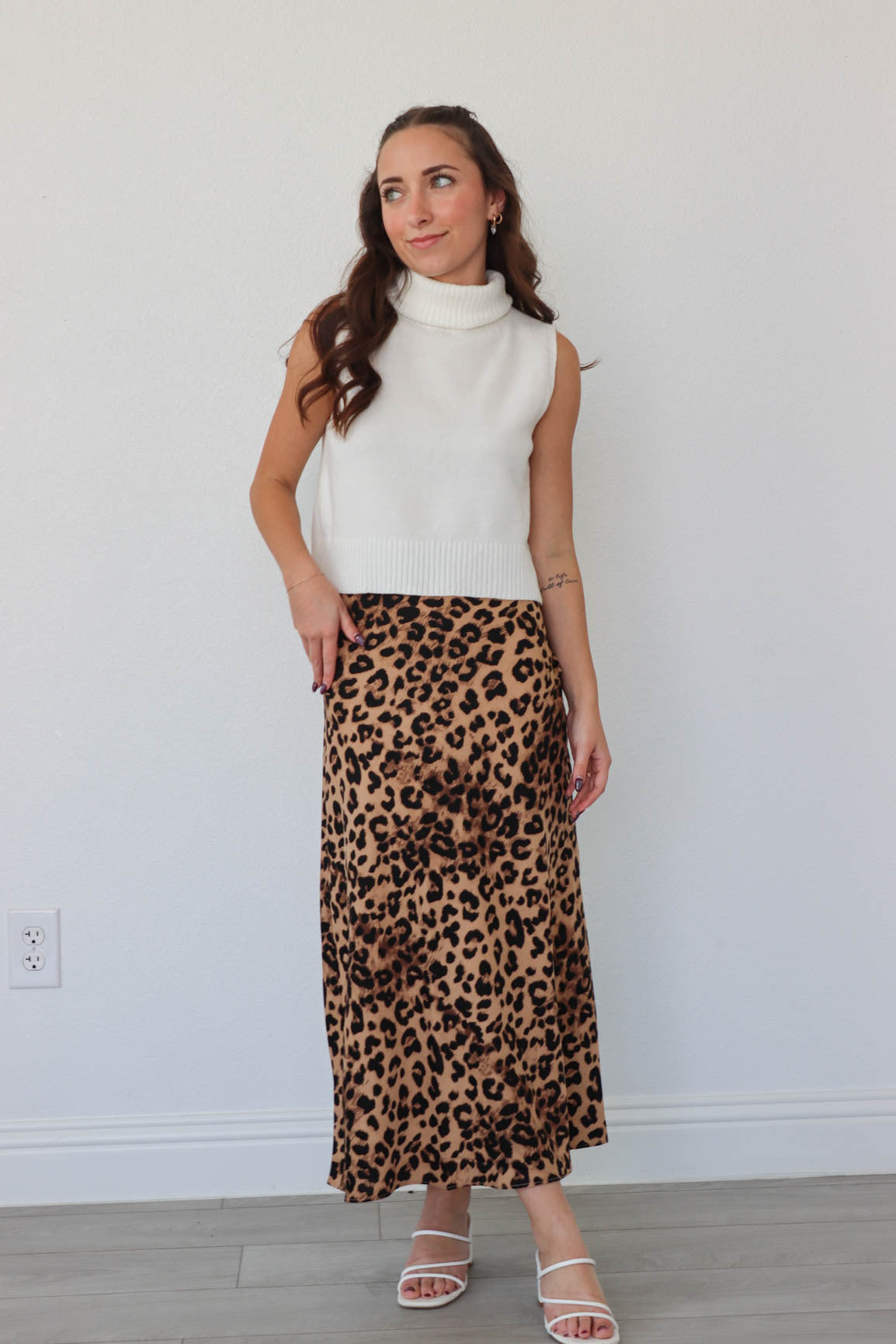 girl wearing leopard print skirt