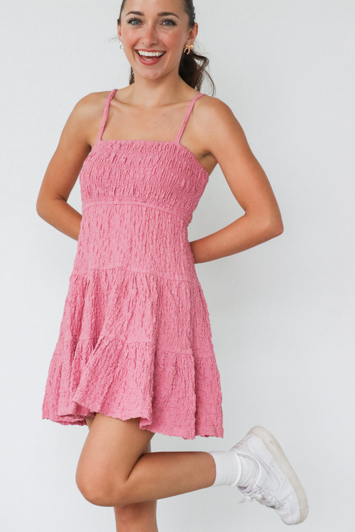 girl wearing pink short summer dress