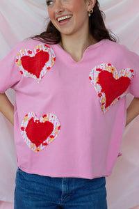 girl wearing pink heart tshirt